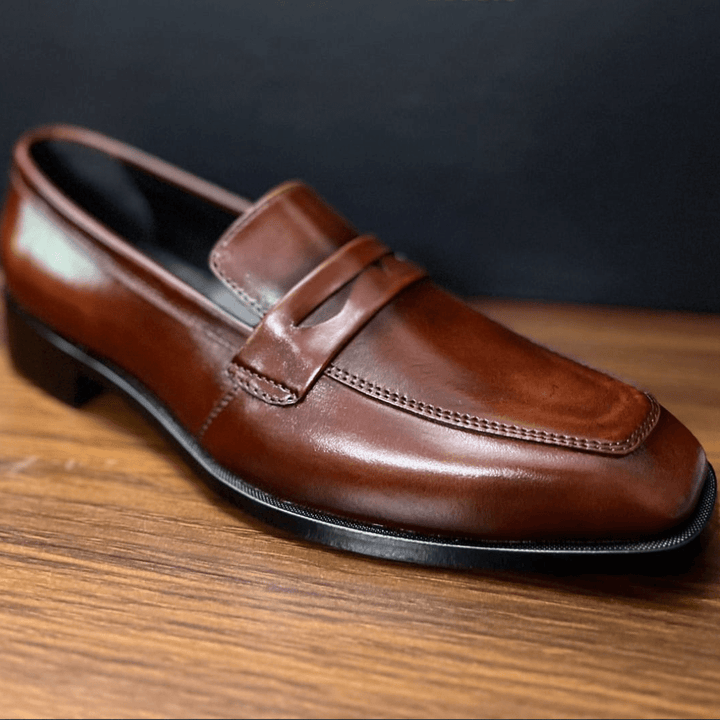 "Classic Brown Leather Penny Loafers – Timeless Sophistication" - Alifdukanstylebyalif types here :)